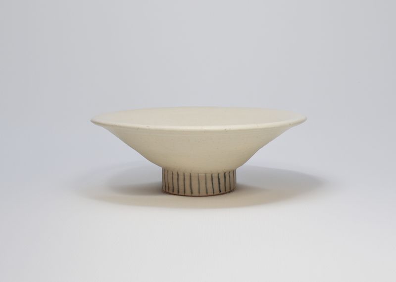 Cream footed bowl with a striped foot