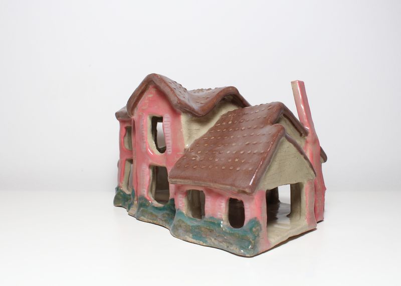 Pink ceramic house, three-quarter view